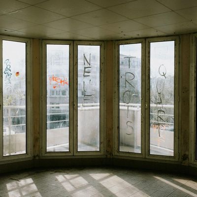 Sunlight streaming through large windows in a gym
